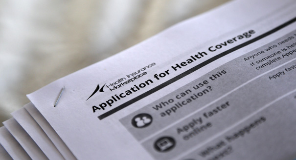 Applications are seen at a rally held by supporters of the Affordable Care Act in Jackson, Mississippi